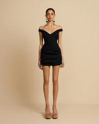 Arcina Ori Avery black mini dress – off-shoulder little black dress with elegant neckline and flattering true-to-size fit. Hire from Tenn Designer Hire.