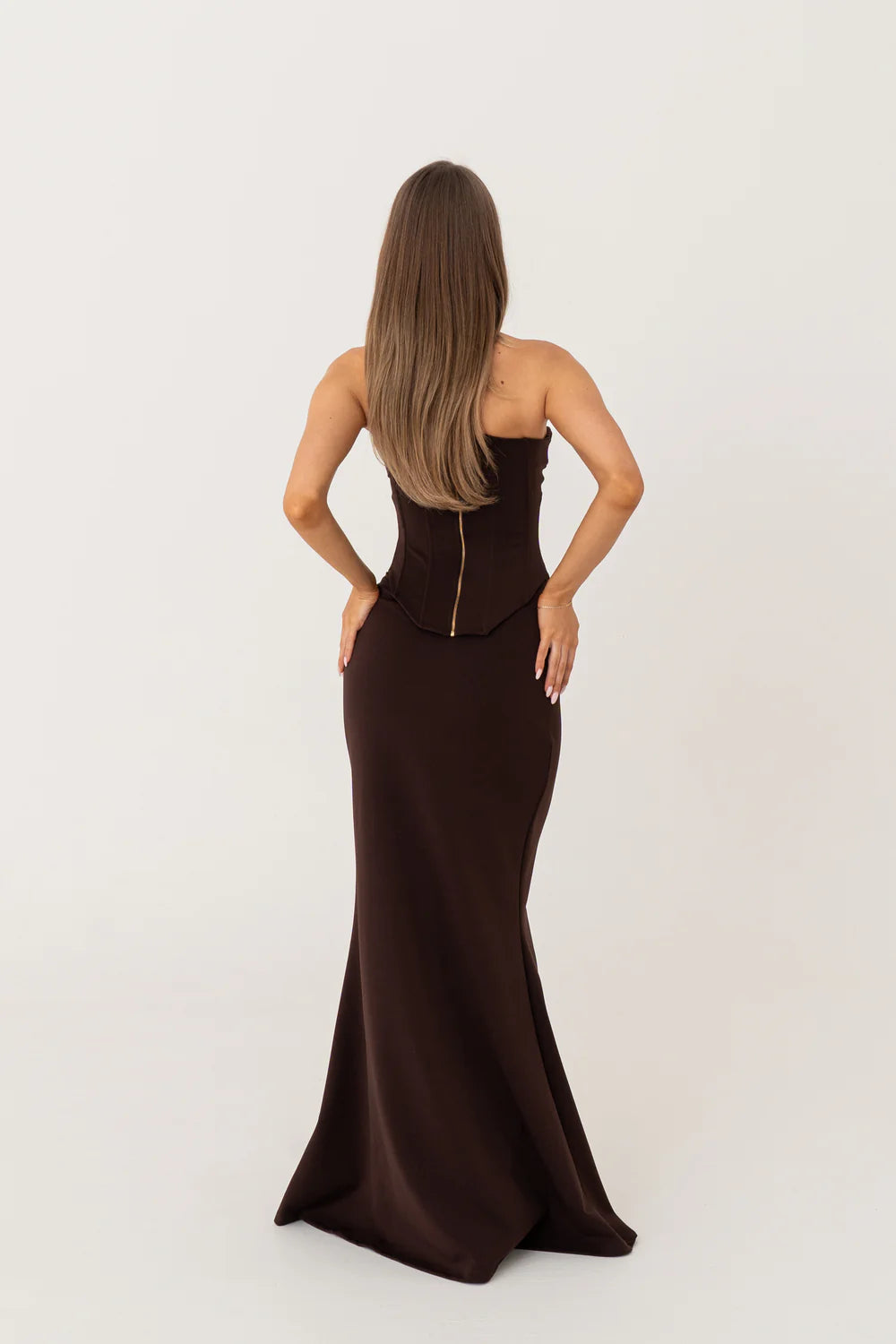 HNTR The Label Louie Gown in brown – strapless two-piece gown with longline corset and body-hugging maxi skirt. Hire from Tenn Designer Hire.