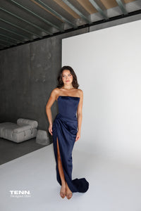 Diour Gown by Lia Stublla Hire in Navy – Luxe Satin Gown with Straight Neckline, Corseted Bodice, Thigh-High Split, and Waist Ruching.