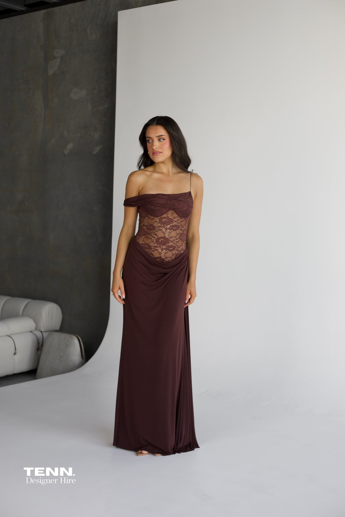 Natalie Rolt Sloane Espresso Dress For Hire – Sheer Lace And Chiffon Gown With Elegant Silhouette And Flowing Fabric.