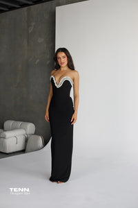 Albina Dyla Serpent Curve strapless black gown with gemstone embellishments, corset bodice, and lace-up back — figure-hugging evening dress from Tenn Designer Hire.
