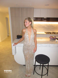 Albina Dyla Stardust Cascade Gown – plunging halter neckline gown with silver bead embellishments, corseted fit, and back leg slit. Hire from Tenn Designer Hire.