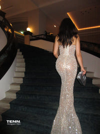 Albina Dyla Golden Couture Gown available for hire at TENN Designer Hire — luxurious gold gown with halter neckline, corseted bodice, diamond detailing, and figure-hugging skirt, handcrafted with thousands of hand-sewn adornments.