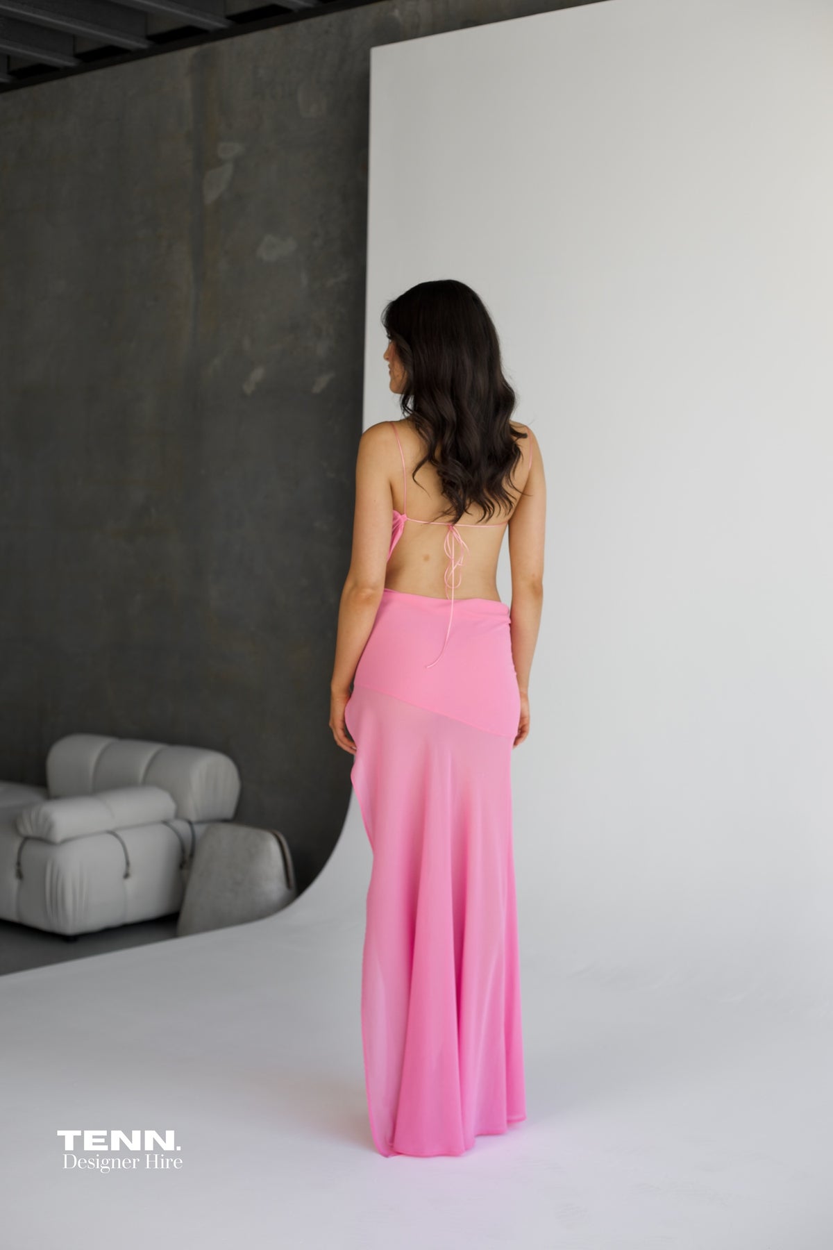 Natalie Rolt Dahlia Gown available for hire at TENN Designer Hire — elegant resort-style gown in dropped chiffon with sweetheart neckline, crossover detailing, waist cut-out, and flowing silhouette, perfect for formal events.