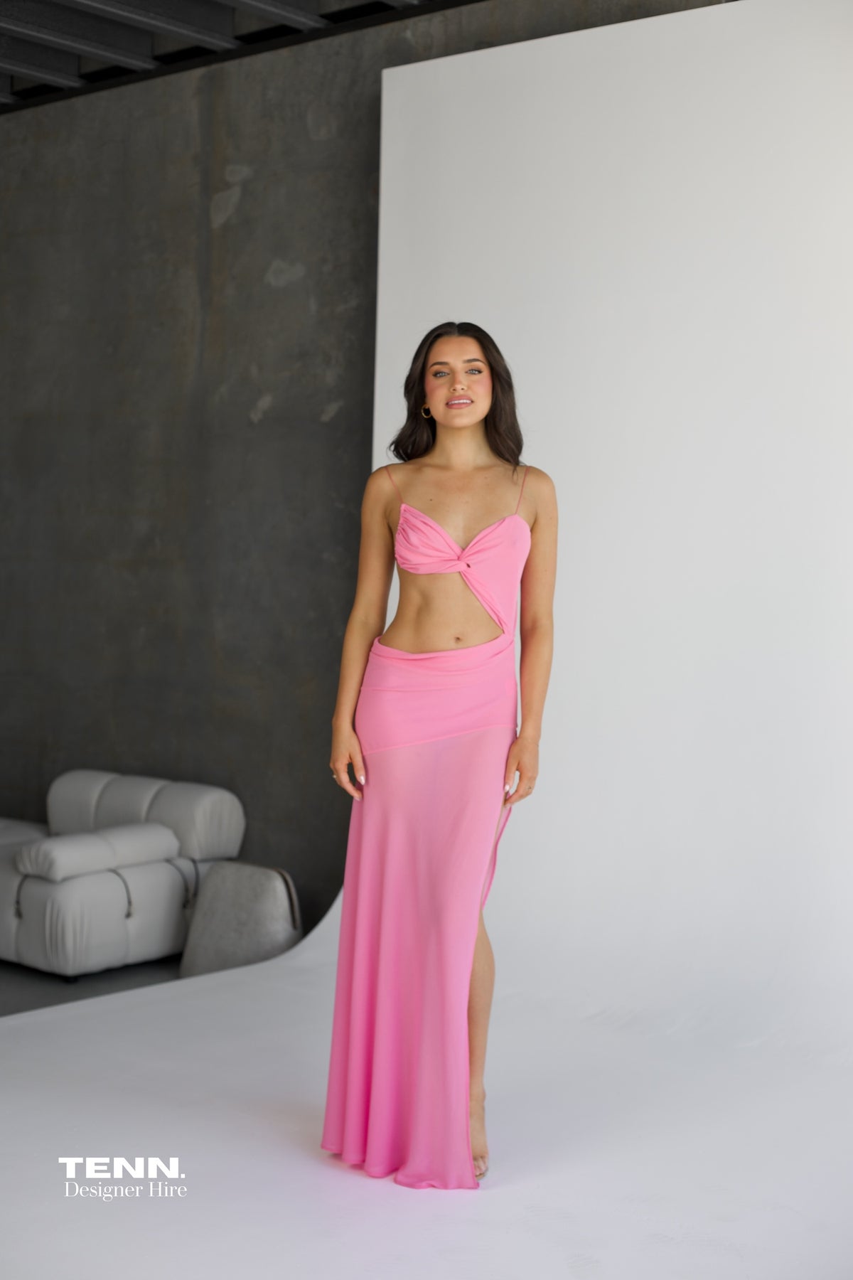 Natalie Rolt Dahlia Gown available for hire at TENN Designer Hire — elegant resort-style gown in dropped chiffon with sweetheart neckline, crossover detailing, waist cut-out, and flowing silhouette, perfect for formal events.