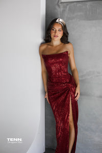 Lia Stublla Chanel Gown in wine – two-piece formal gown featuring a boned corset bodice, lace-up back, twist-detail skirt, and thigh-high split. Hire from Tenn Designer Hire.
