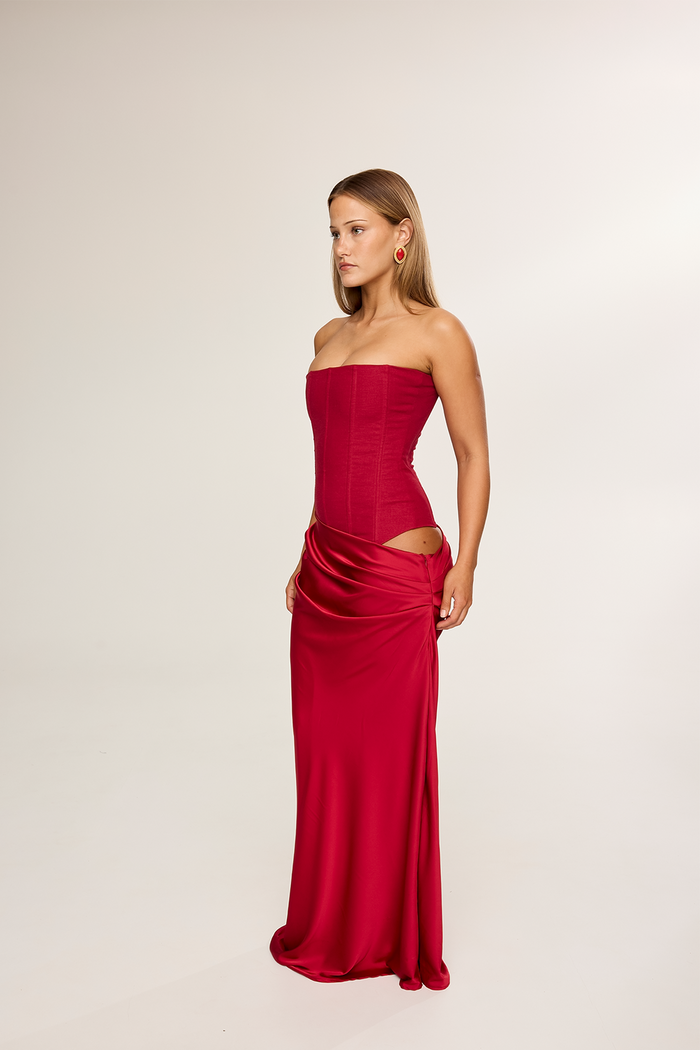 HNTR The Label Huxley Gown in wine – two-piece strapless gown with longline corset bodice and flowing silky skirt. Hire from Tenn Designer Hire.