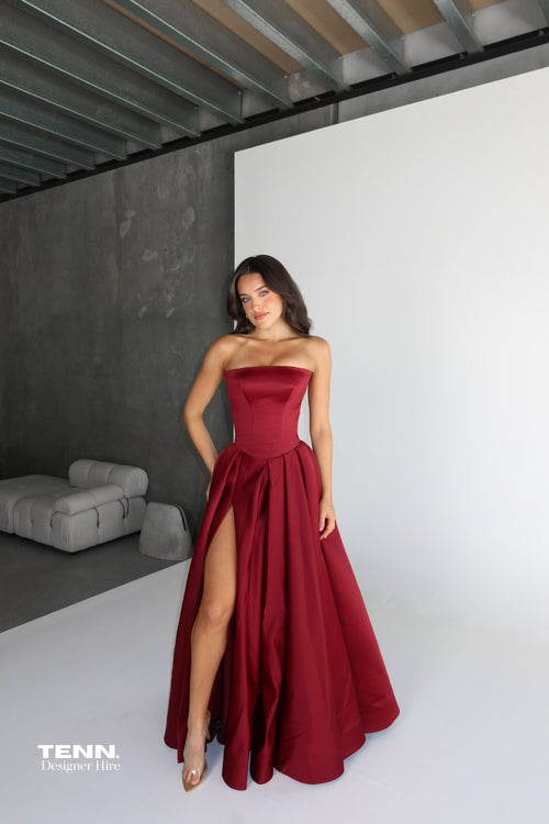 Elodie Gown by Lia Stublla x TENN Hire in Wine – Original Design Featuring Structured Bodice, Drop Waist, Voluminous Ball Gown Skirt, and Leg Split.