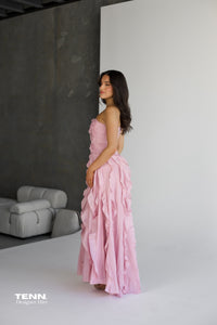 Aje Allairie Gown in pink available for hire at TENN Designer Hire — elegant strapless formal gown with asymmetric cascading ruffles and flowing voluminous skirt, perfect for garden weddings and summer events.