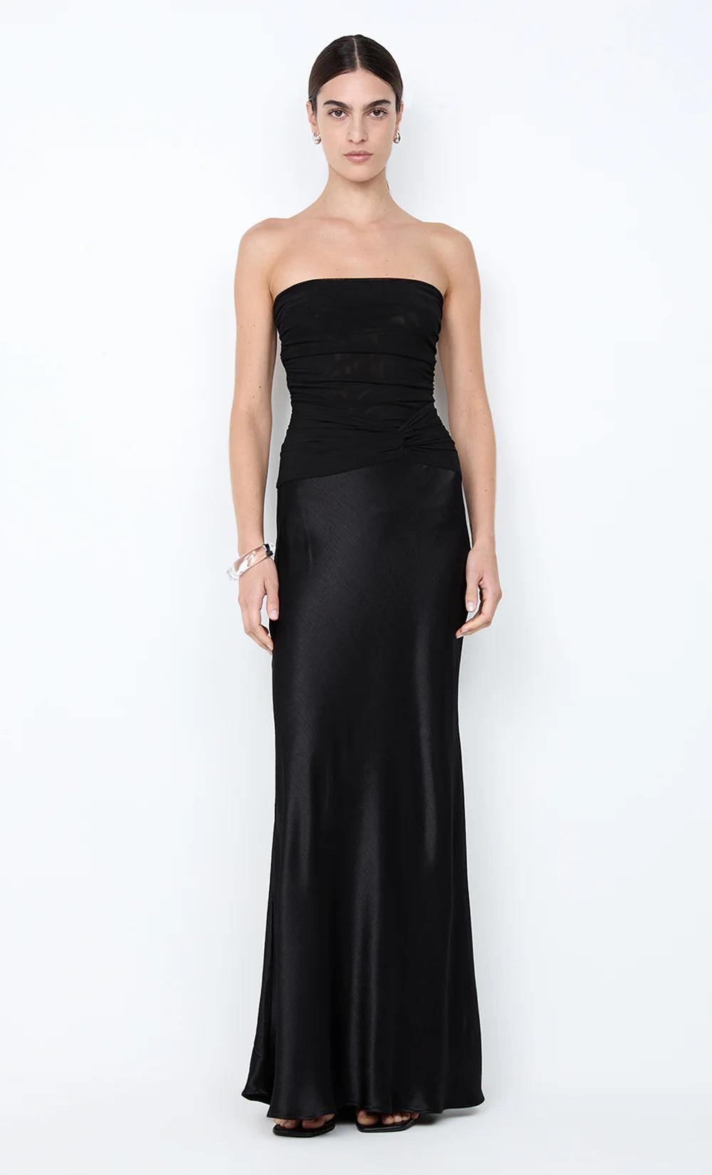 Bec and Bridge Millah Black Strapless Maxi Dress available for hire at TENN Designer Hire — chic and feminine gown with a strapless neckline, pinched waist detailing, and silky skirt that creates an elegant, effortless silhouette.