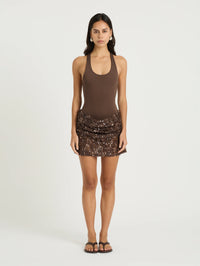 Benni Ariel Cocoa Mini Dress available for hire at TENN — a chic summer mini dress featuring a body-skimming halter bodysuit paired with a glowing crochet and sequin skirt, perfect for warm weather events.