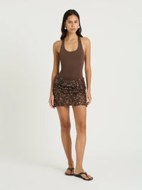 Benni Ariel Cocoa Mini Dress available for hire at TENN — a chic summer mini dress featuring a body-skimming halter bodysuit paired with a glowing crochet and sequin skirt, perfect for warm weather events.