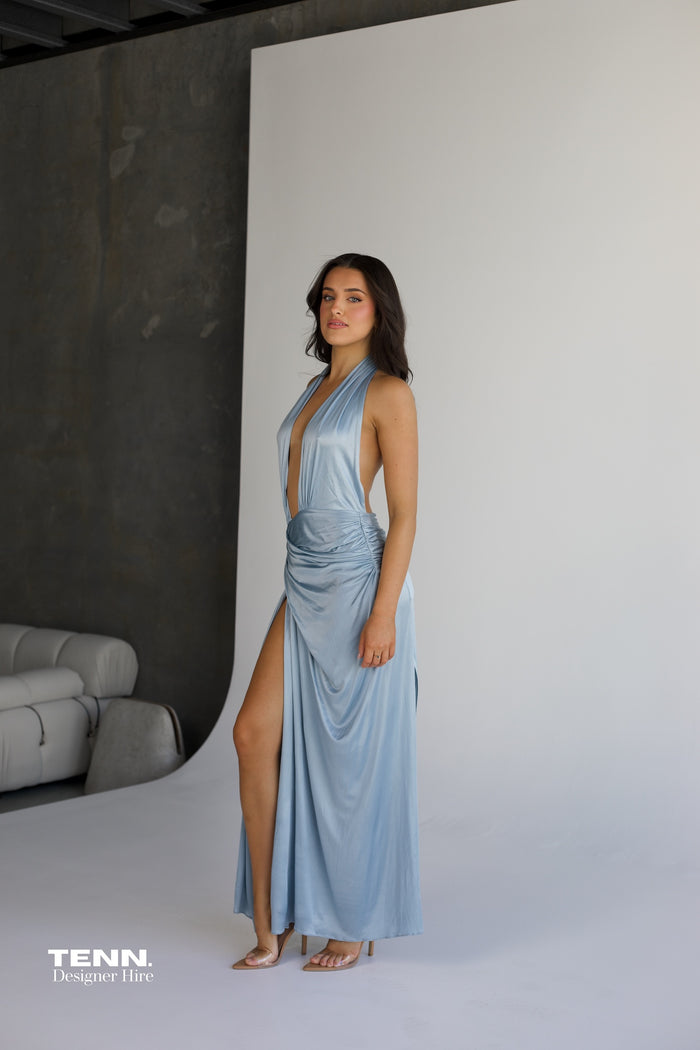 Courtney Zheng Selene Plunge Jersey Gown in sky blue available for hire at TENN Designer Hire — silky fluid gown with deep plunging neckline, open back, gathered waist, and high slit, perfect for formal events and red carpet occasions.