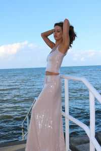 Lane & Sass Aria Cami and Aria Skirt in blush available for hire at TENN Designer Hire — elegant two-piece set featuring soft scoop neckline with subtle shimmer, floaty feminine skirt, elasticated waist, and versatile day-to-night styling options.