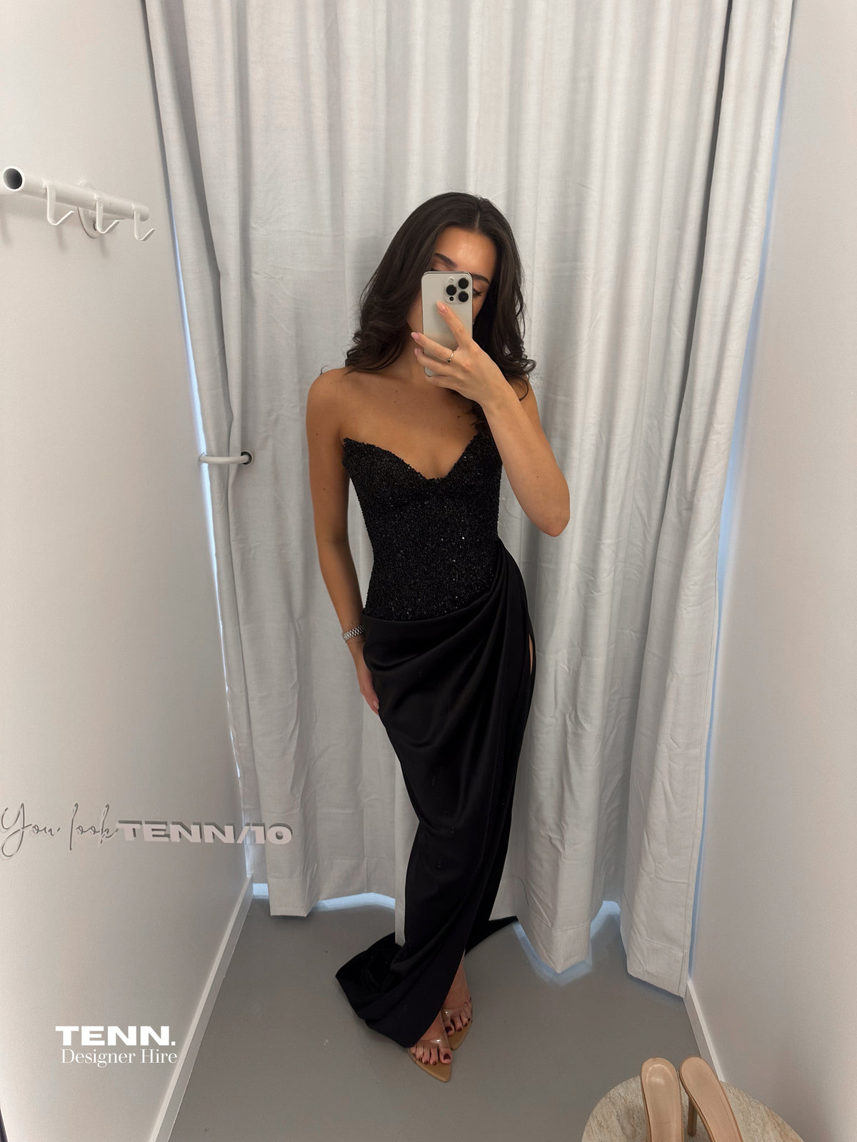 Lia Stublla Duchess Black Gown available for hire at TENN Designer Hire — features a cupped neckline, hand-beaded haute couture bodice, thigh-high slit and luxe satin fabric for a show-stopping formal look.