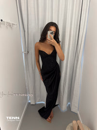 Lia Stublla Duchess Black Gown available for hire at TENN Designer Hire — features a cupped neckline, hand-beaded haute couture bodice, thigh-high slit and luxe satin fabric for a show-stopping formal look.