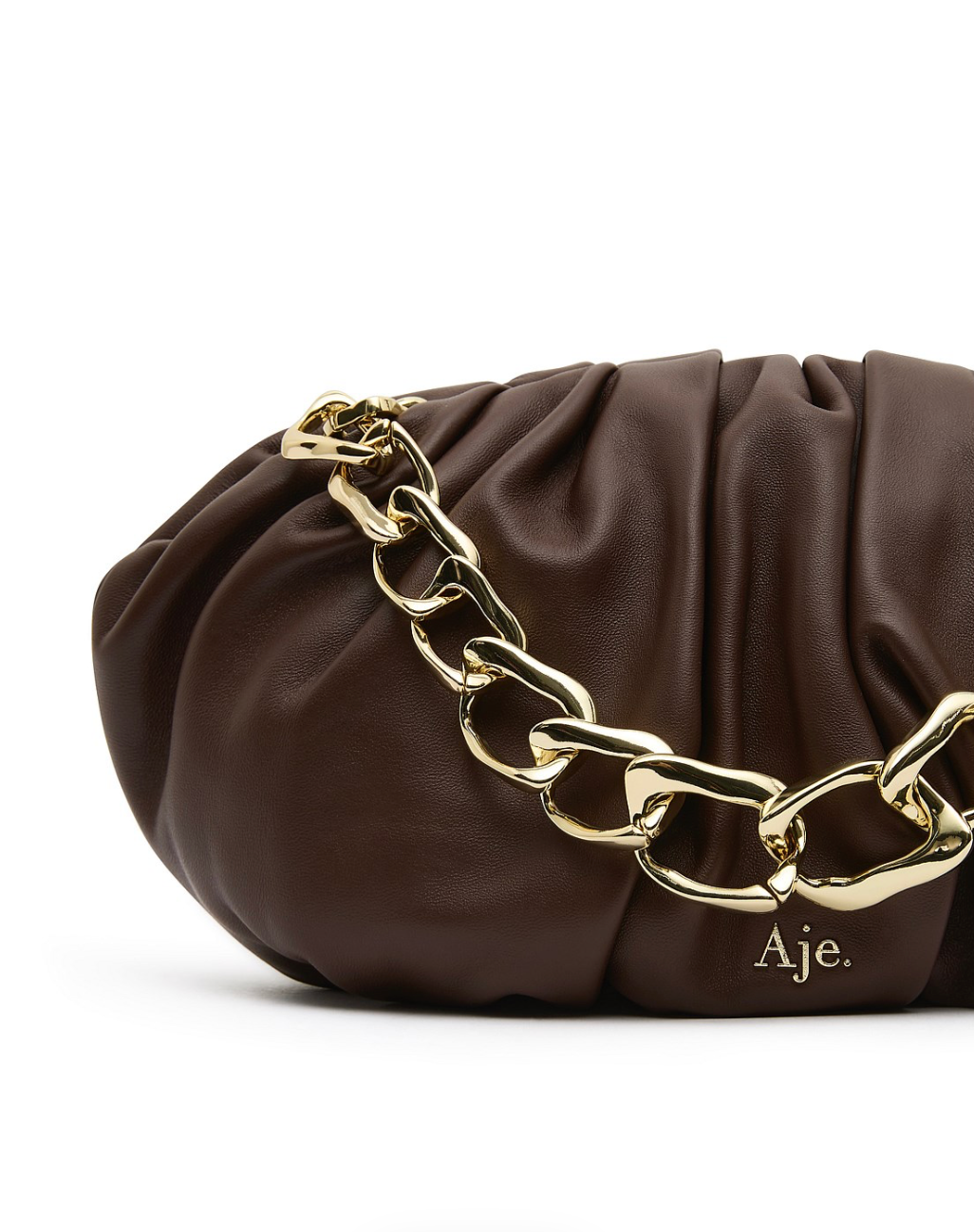 Aje Arden Clutch in brown leather with organic link hardware detailing, luxury designer bag available for hire from TENN Designer Hire.